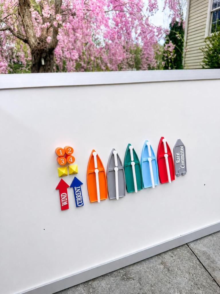 Kit displayed on a whiteboard fence outdoors